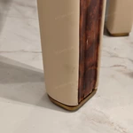Upholstered-Leg Dining Table with Amber Burl Wood Top and Metal Accents